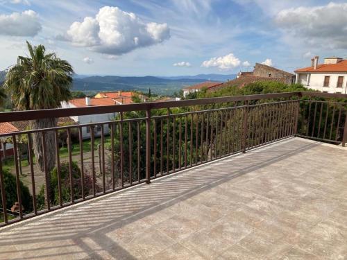 a balcony of a house with a fence at Apartamentos Las Huertas in Villamiel