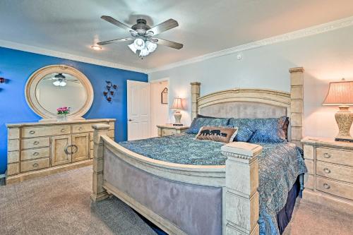 a bedroom with a bed and a ceiling fan at Near Trails, Lakes and Golf Pinetop Home with Deck in Pinetop-Lakeside