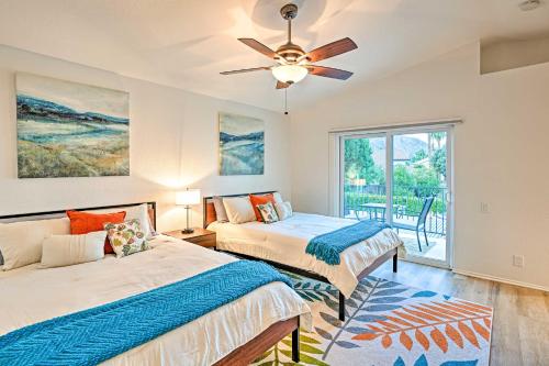 a bedroom with two beds and a ceiling fan at Pet-Friendly La Quinta Gem with Pool and Yard Games in La Quinta
