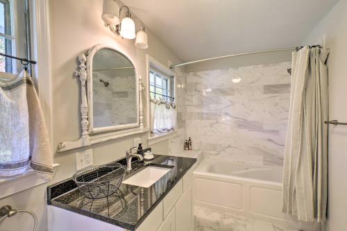 a white bathroom with a sink and a tub at Mod Stable House on 10 Acres, Walk to Lake! in Oakwood