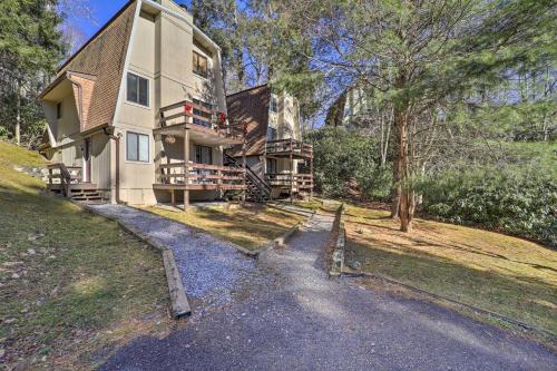 a large house on a hill with a driveway at 2 Mi to Dtwn Banner Elk! Couples Retreat with Deck in Banner Elk