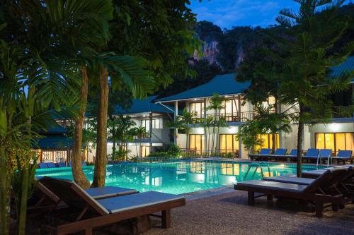 a resort with a swimming pool in front of a building at Dream Valley Resort, Tonsai Beach in Tonsai Beach