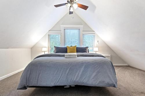 a bedroom with a bed with a ceiling fan at Starfall in Yosemite West
