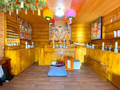 a room with wood paneled walls and a altar in a temple at Fukoji in Kawaba