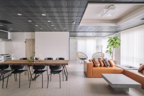 a living room with a couch and a table at INFINITY HOTEL -jicchaku- in Nakanishi