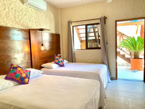 Cama o camas de una habitación en Hotel Casa Lupita