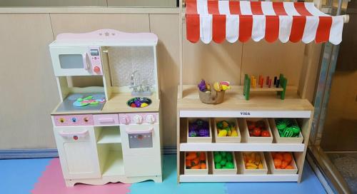 a doll house with a kitchen and a playset at Shianghu Boutique Hotel in Chiayi City