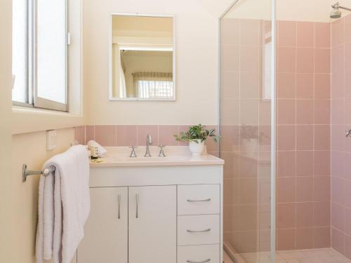 a bathroom with a sink and a shower at Pacific Motel 10 in Forster