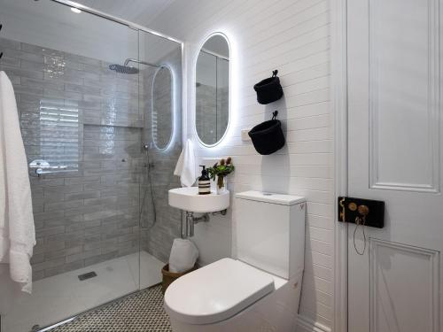 a bathroom with a toilet and a sink and a shower at The Elm Tree in Daylesford
