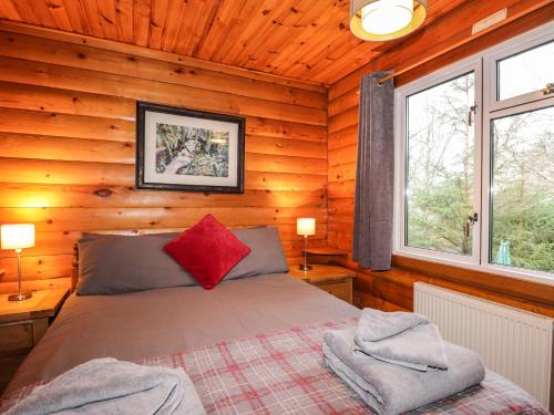 Кровать или кровати в номере Rowan Lodge