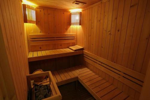 an inside view of a wooden sauna at Amora Thapae Hotel Chiang Mai in Chiang Mai