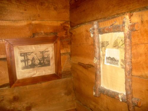 a picture in a wooden wall with a picture on it at Almhütte Gorgasser in Heiligenblut
