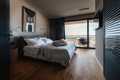 Postel nebo postele na pokoji v ubytování Villas Misto