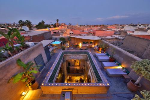 an overhead view of a building with a swimming pool at Riad Dar One in Marrakech