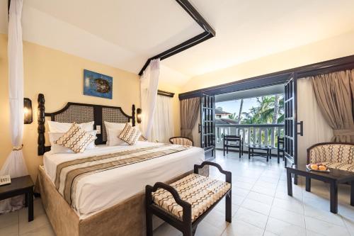 Postel nebo postele na pokoji v ubytování PrideInn Flamingo Beach Resort & Spa Mombasa