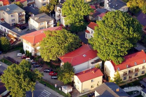 an overhead view of a city with houses and trees at Rezydencja 5 Dębów in Międzyzdroje