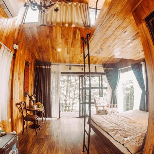 a bedroom with a bunk bed in a tree house at Chillout Village - Homestay Tam Đảo in Vĩnh Phúc