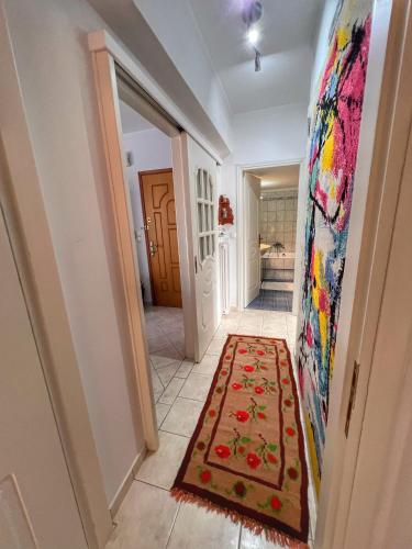 a hallway with a painting on the wall and a rug at "Mykines" Apartment of Levidi Arcadian Apartments in Levidhion