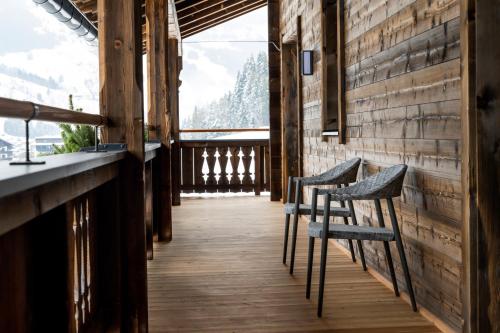 a row of chairs in a room with a window at Wieshofgut in Saalbach Hinterglemm