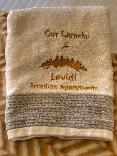 a towel with the name of a city landscape on it at "Mykines" Apartment of Levidi Arcadian Apartments in Levidhion