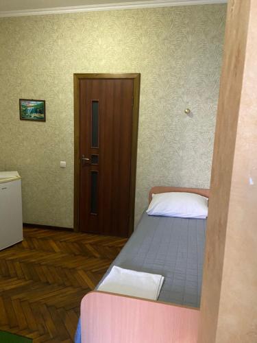 Кровать или кровати в номере Отель Кардинал