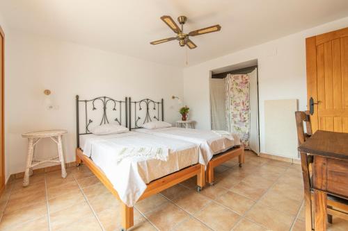 En eller flere senge i et værelse på Casa del Pino