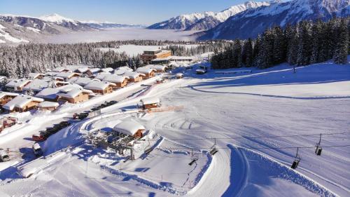 an aerial view of a resort in the snow at Jugendgästehaus Gerlosplatte in Krimml