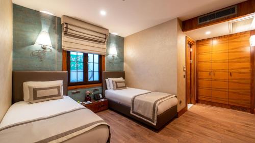 Postel nebo postele na pokoji v ubytování Biz Cevahir Hotel Sultanahmet
