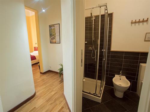 a bathroom with a toilet and a glass shower at Residenza Viani Guest House in La Spezia