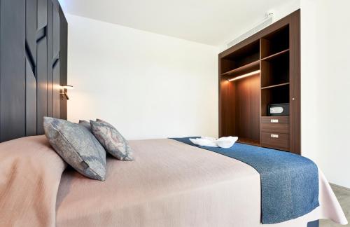 Postel nebo postele na pokoji v ubytování BelleVue Club
