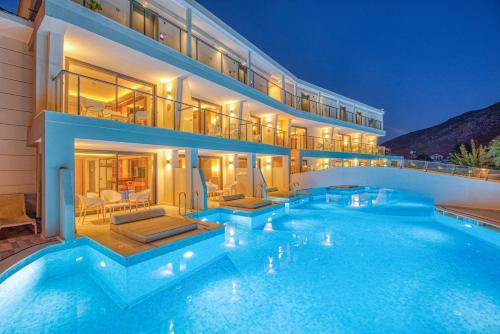 a large swimming pool in front of a building at Orka World Hotel & Aquapark in Oludeniz