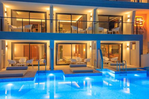 a house with a swimming pool in front of it at Orka World Hotel & Aquapark in Oludeniz