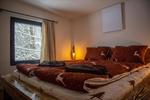 En eller flere senge i et værelse på Holiday Nature House