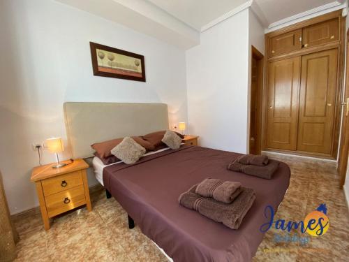 A bed or beds in a room at La Ciñuelica R14 1st Floor Apartment Com Pool L182