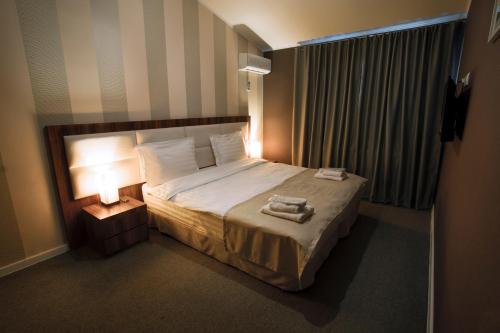 Кровать или кровати в номере Hotel West