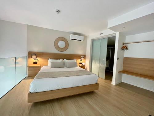 Postel nebo postele na pokoji v ubytování Hotel Emblemático Hi Suites