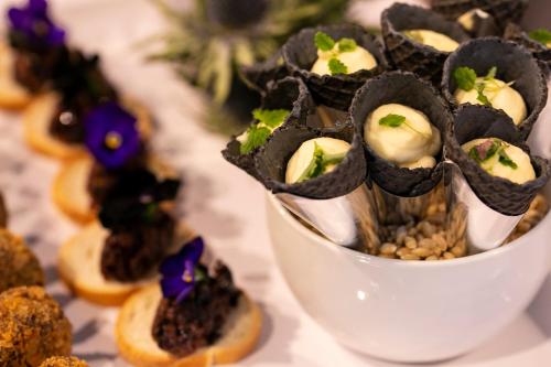 a white bowl filled with food on a table at Kimpton Blythswood Square Hotel & Spa by IHG in Glasgow