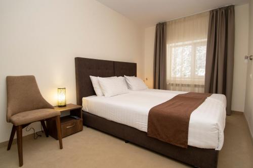 Кровать или кровати в номере Hotel Malyovitsa