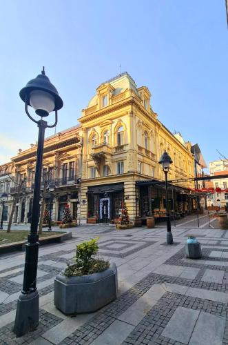 a street light in front of a large building at NATALI Luxury suites in Belgrade