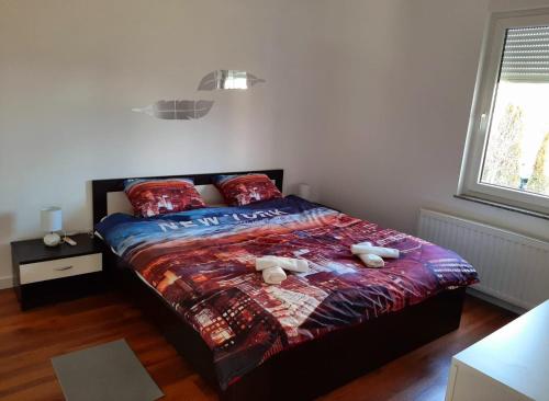 A bed or beds in a room at Apartman EVA ZAGREB