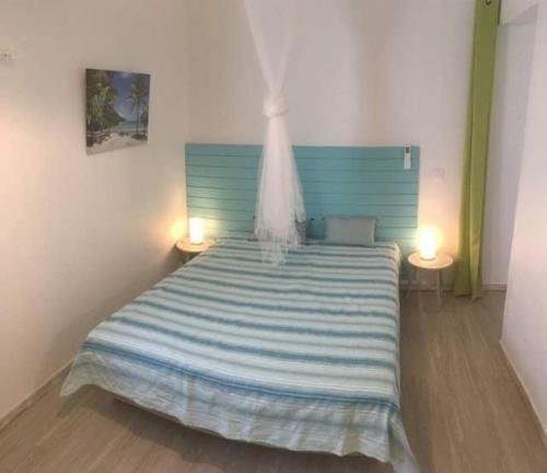 Postel nebo postele na pokoji v ubytování Petit Havre Bleu