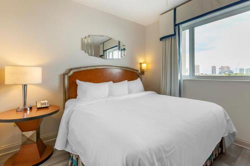 a bedroom with a white bed and a window at Bluegreen Vacations Club 36 in Las Vegas