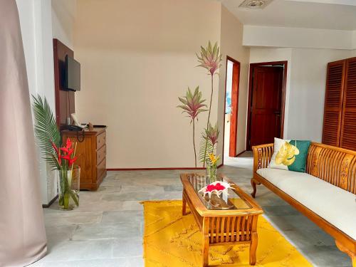 a living room with a couch and a coffee table at Hilltop Boutique Hotel in Victoria