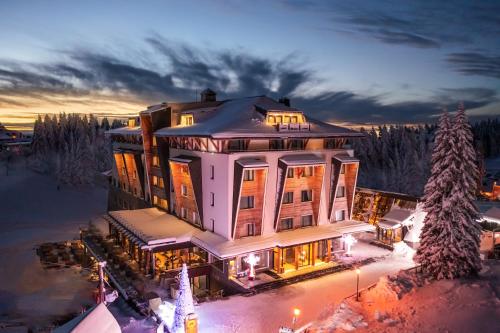an aerial view of a large building in the snow at Gorski Hotel & Spa in Kopaonik