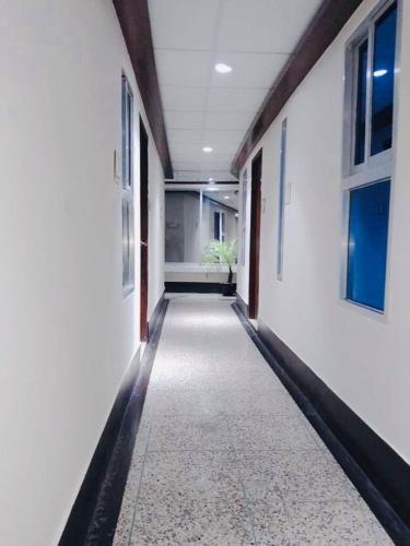 an empty hallway of an office building with a hallway at Hotel Seven Star in Dhaka