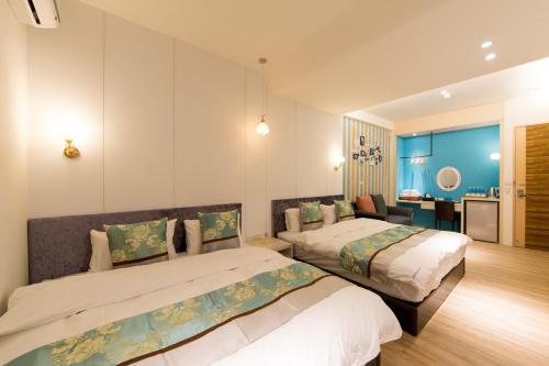 Ένα ή περισσότερα κρεβάτια σε δωμάτιο στο Tainan Pickup Light