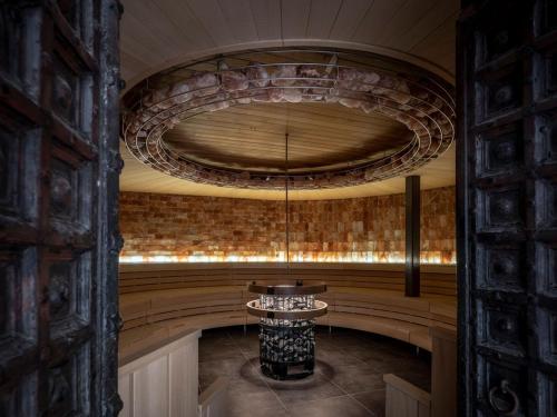 a room with a stone wall and a circular ceiling at Boshuisje La Casita - Near Wellness & Golf in Oosterhout