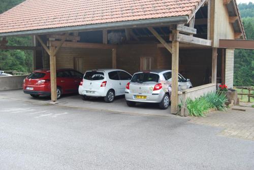 a group of cars parked in a garage at Chambre d'hôtes Kieffer Le Grand Bienfaisy in Remiremont