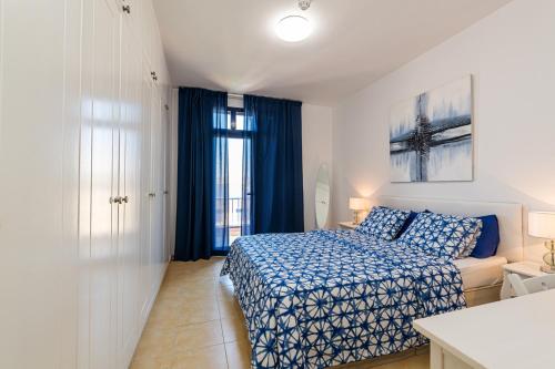 Ένα ή περισσότερα κρεβάτια σε δωμάτιο στο Bahía Meloneras Fase II