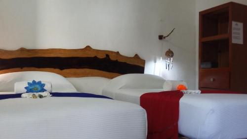 Postel nebo postele na pokoji v ubytování Pacha Tulum Boutique Hotel